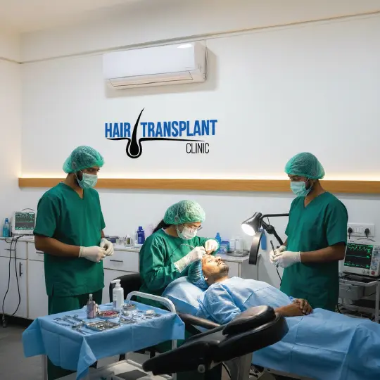 Hair transplant clinic surgeons performing FUE hair restoration procedure on patient